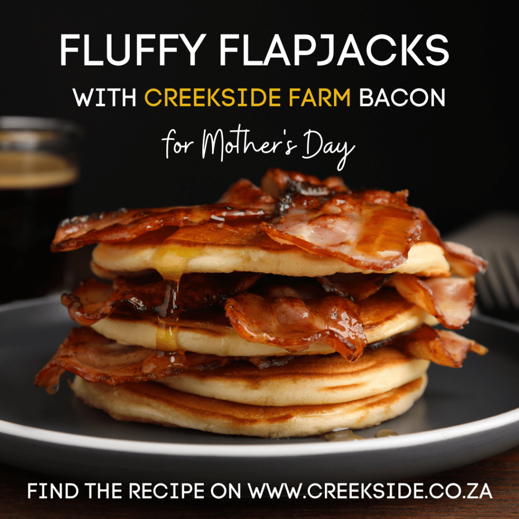 A stack of flapjacks layered with crispy streaky bacon